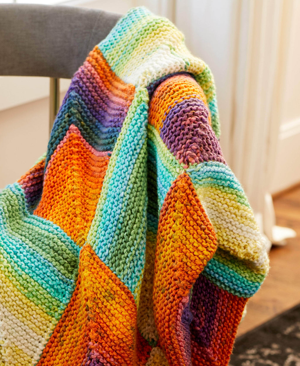Premier Yarns - Looking to learn a new stitch? The Colorful Cluster Throw  uses a Stacked Cluster Stitch that gives the blanket a unique definition.  Yarn: Premier Puzzle 1050-31 Hopscotch  . . #