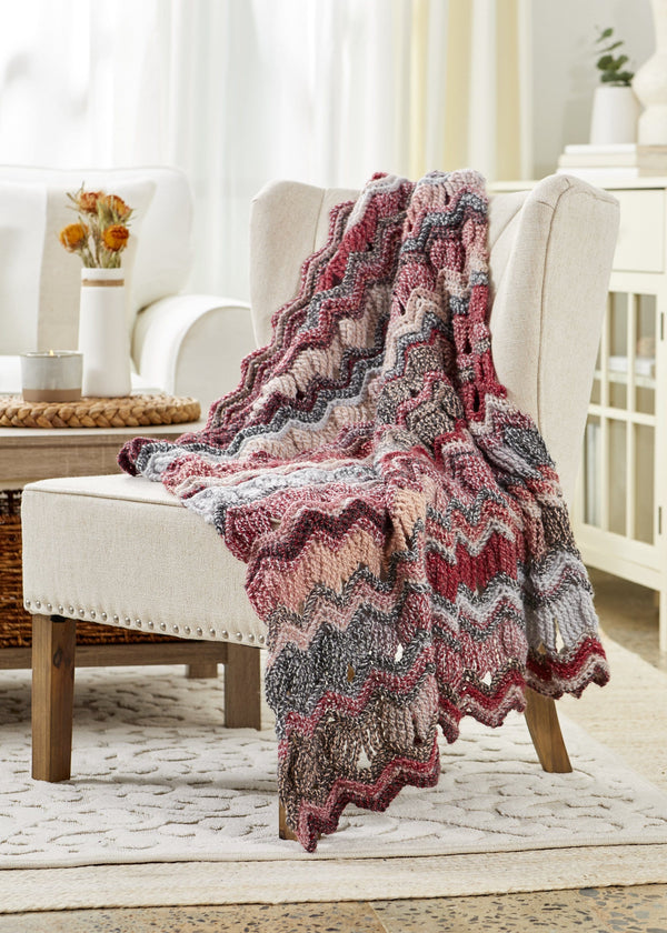 Premier Yarns - Have you tried Premier Puzzle? Each ball is made with 4  coordinating colors that combine to create ever-changing, softly blended  stripes. Pattern: Cheyenne Chevron Throw #crochet Yarn: Premier Puzzle